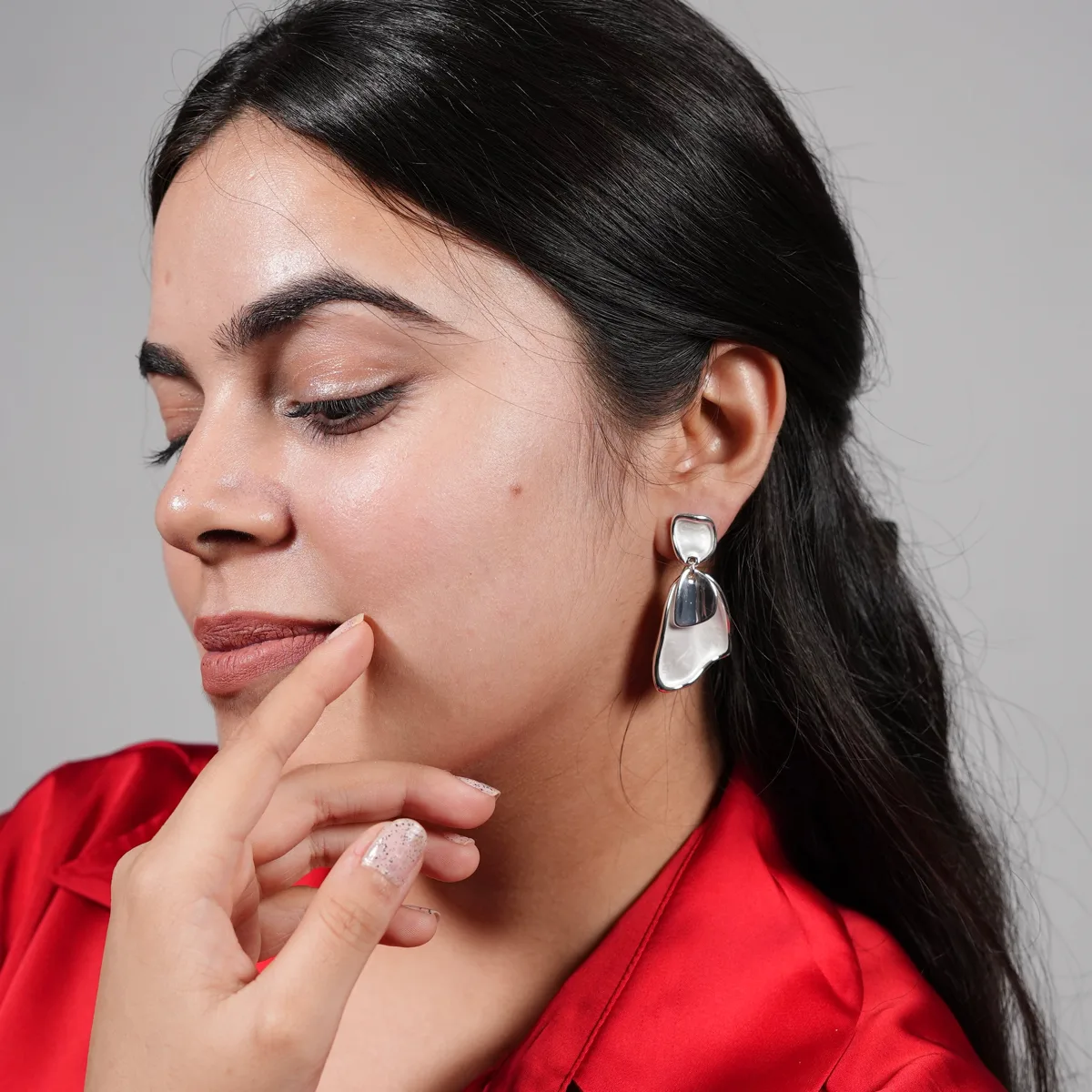 Bhavya wearing Sculpted Abstract Drop Earrings – Silver Fluid Form Statement Studs